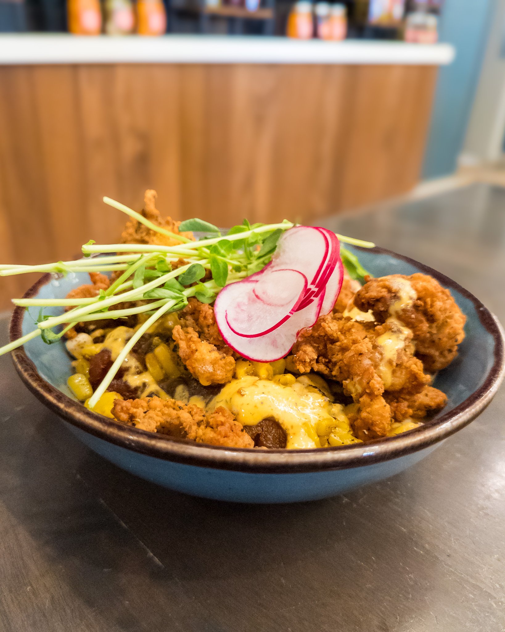 Crispy, saucy, cheesy, and made from scratch. 🤤 Our Buffalo Popcorn Chicken Bowl is a game-changer! 🍗🌶️

&middot; Buttermilk Fried Chicken &middot; House-Made Tater tots &middot; Roasted Corn &middot; Cheese Curds &middot; Chicken Gravy &middot; B