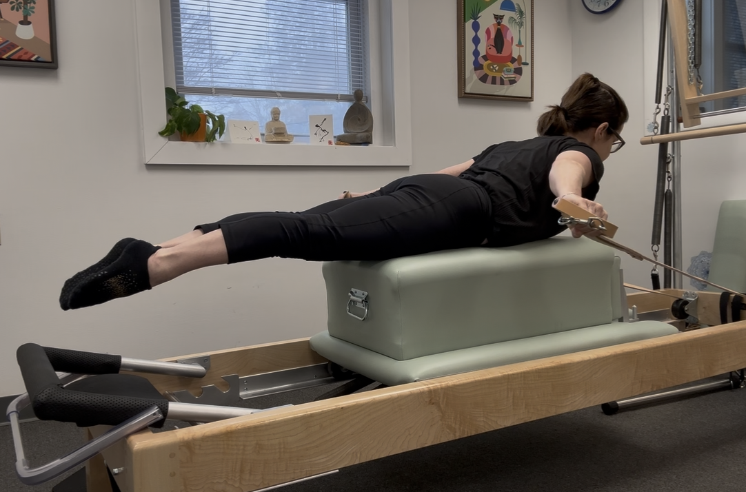 Women doing the exercise Pull Straps on the refomer in a Westport studio