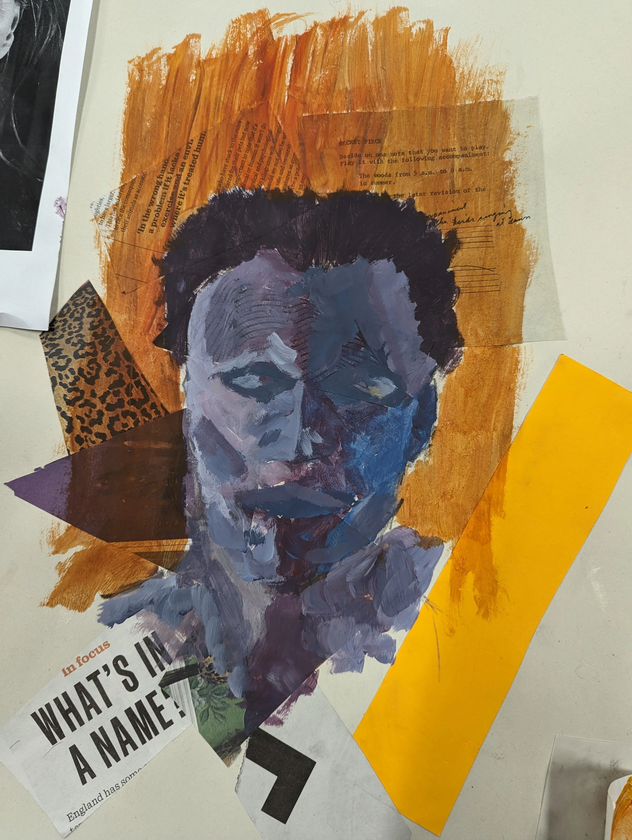 Mixed media collage of a woman's face painted with blue and purple tones, surrounded by torn paper and fabric pieces in warm colors and patterns, including orange paint, leopard print, and yellow paper.