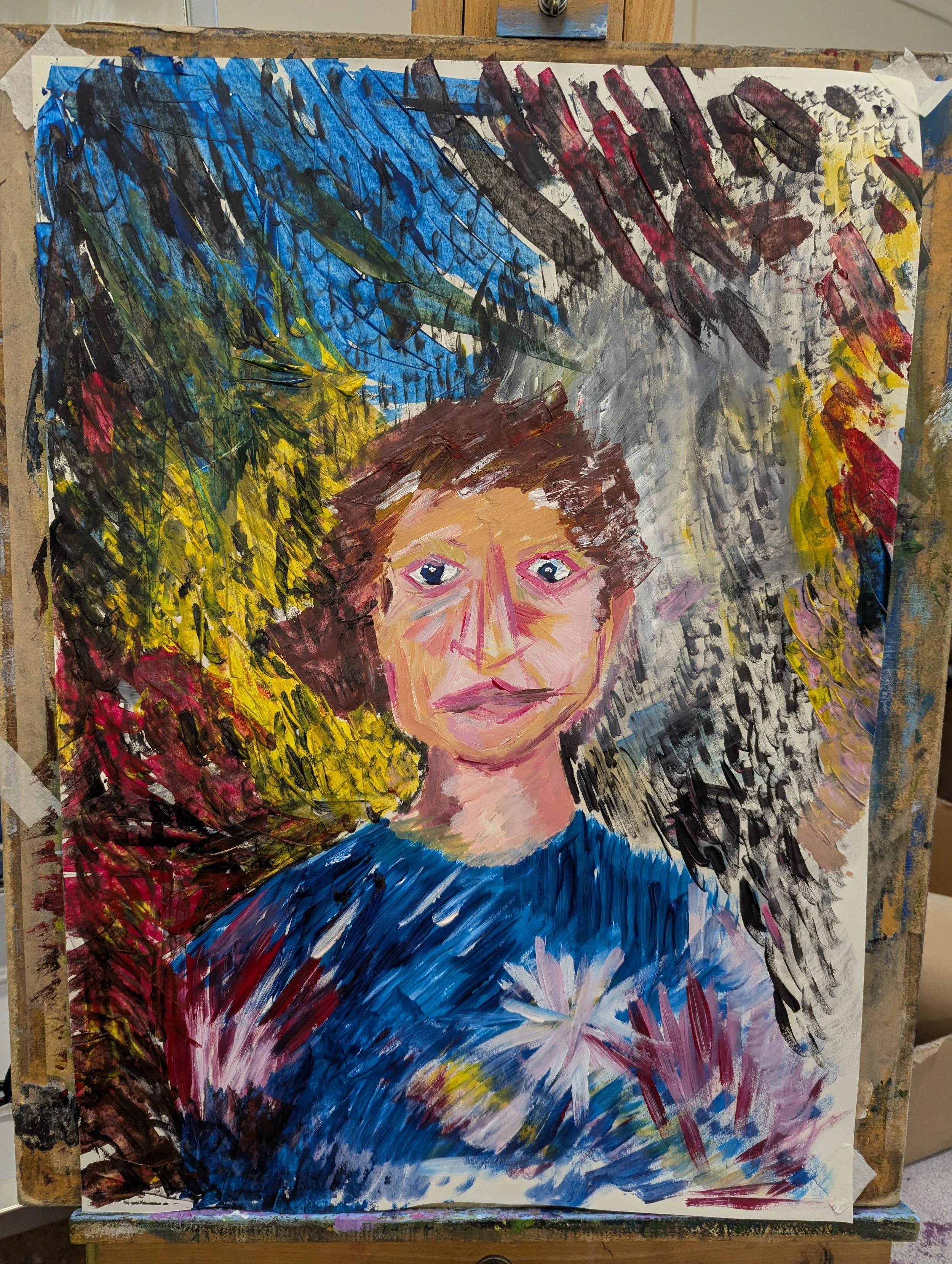 A colorful, expressive portrait of a person with brown hair, blue eyes, and a blue shirt with a white flower on it, surrounded by vibrant, abstract brushstrokes in green, yellow, blue, red, black, and white.