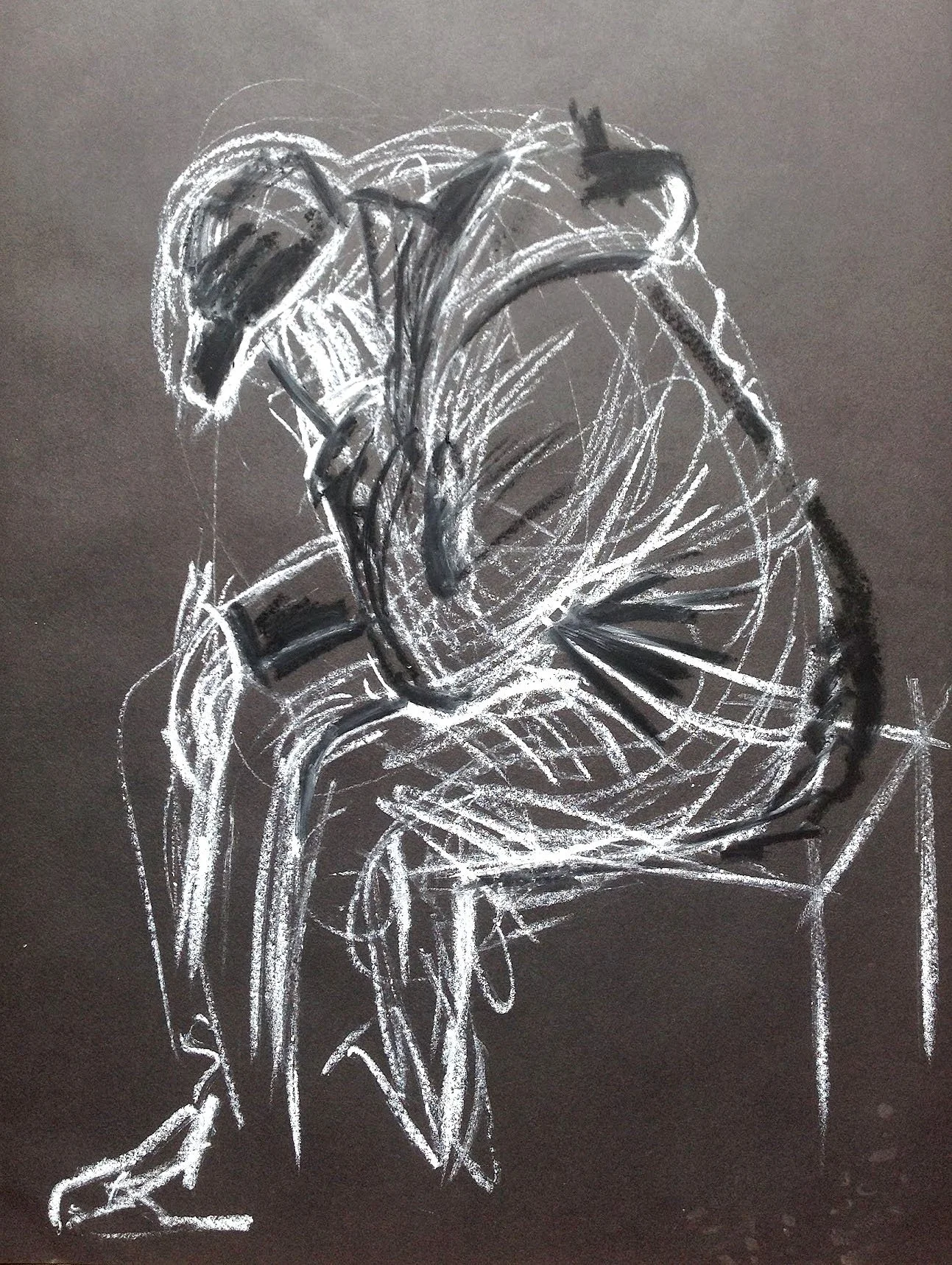 A monochromatic drawing of a figure drawn with white chalk on black paper