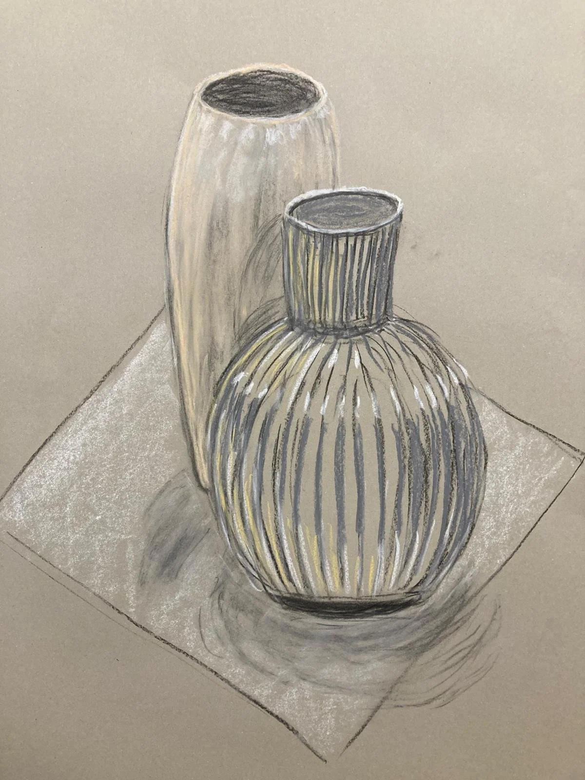 Sketch of three vases with vertical stripes, placed on a surface with a shadow underneath.