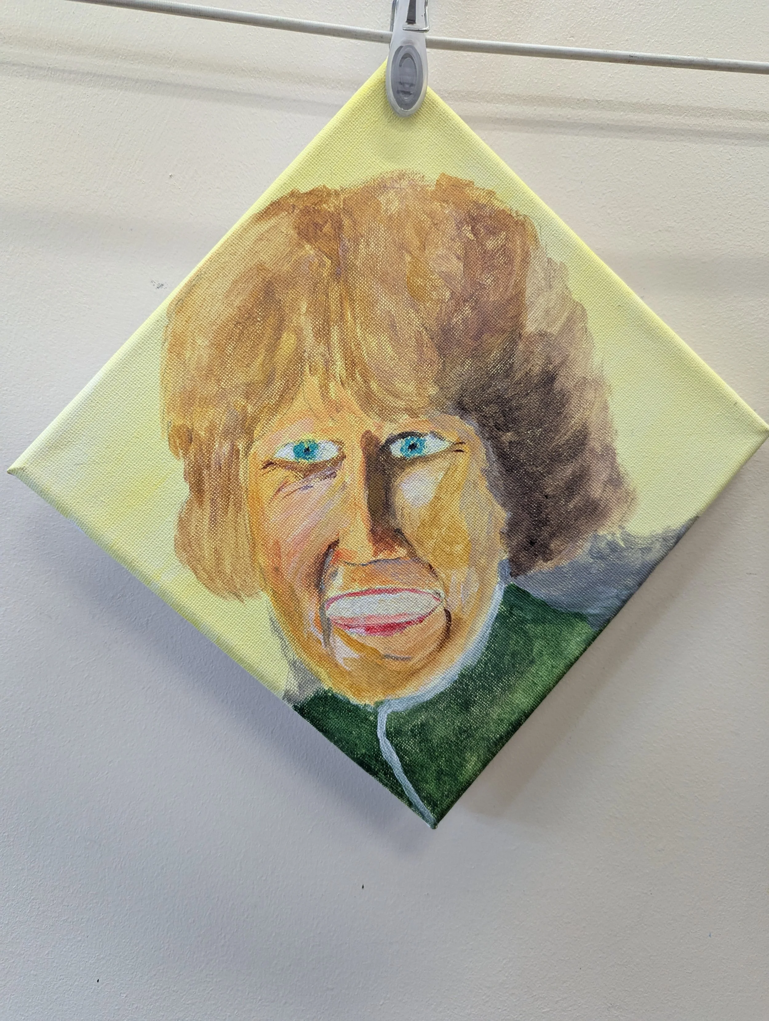 A painting of a woman with blue eyes and brown, voluminous hair, sticking out her tongue, on a light yellow background.