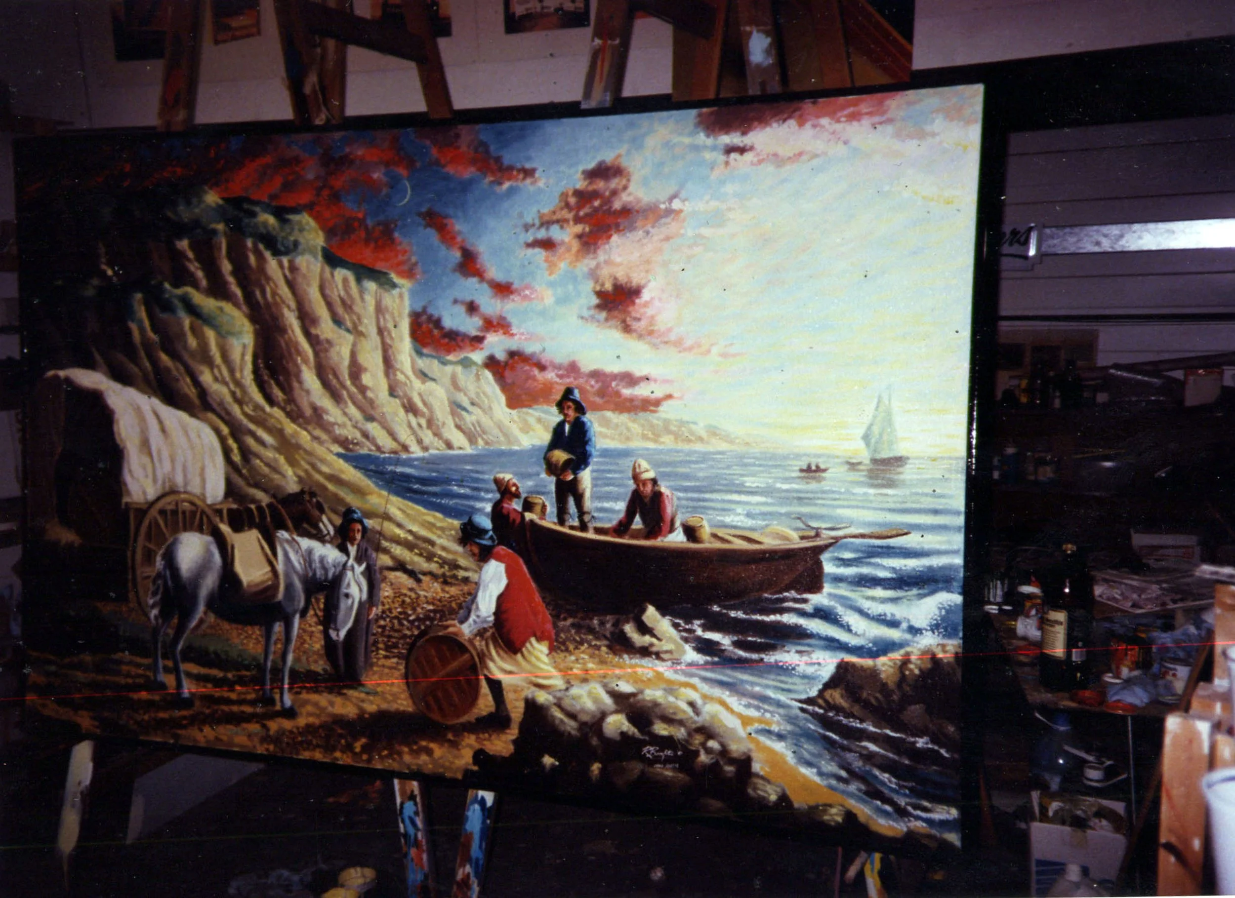 A colorful painting depicts a seaside scene with cliffs, boats, and people (smugglers) in historical clothing, engaging in activities on the rocky shore and in a small boat, with sunset lighting in the background.