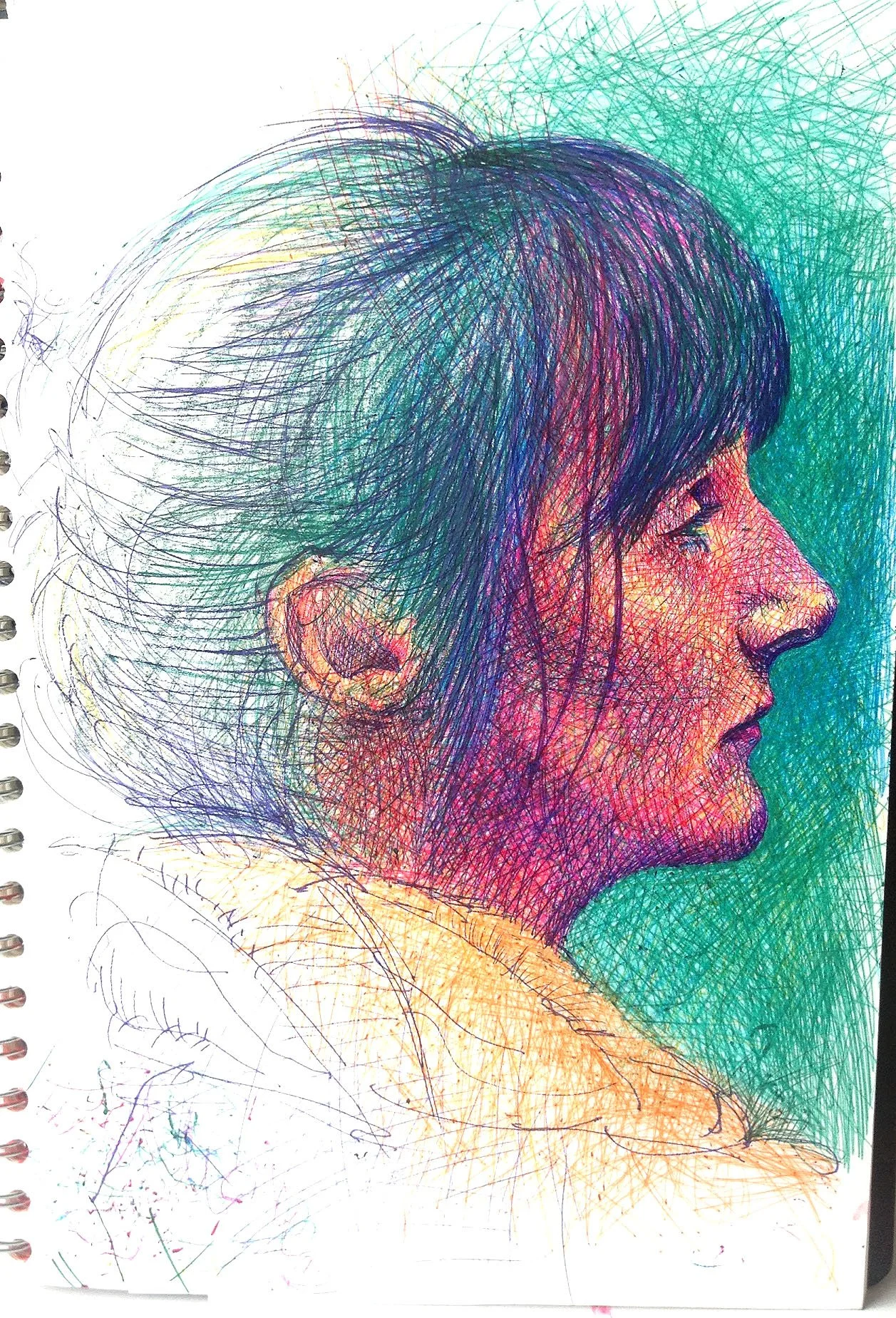 Colorful sketch of a woman's profile with coloured ball point pen lines.