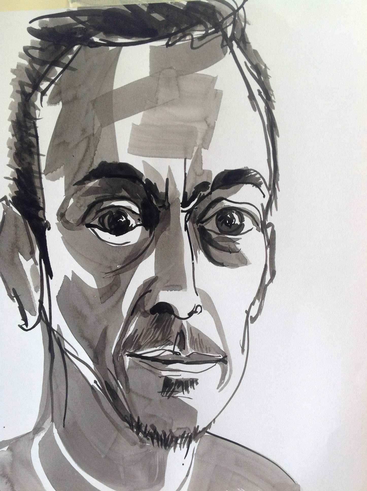 A black and white pen and ink drawing of a man's face with short hair and a thoughtful expression.