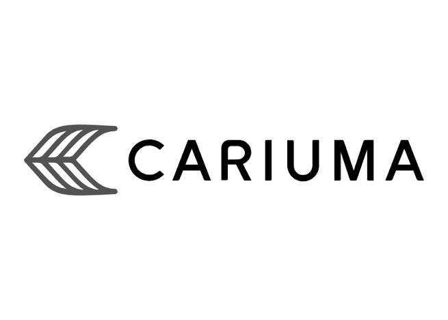 The logo of Cariuma, featuring a stylized gray leaf icon followed by the word 'Cariuma' in black text.