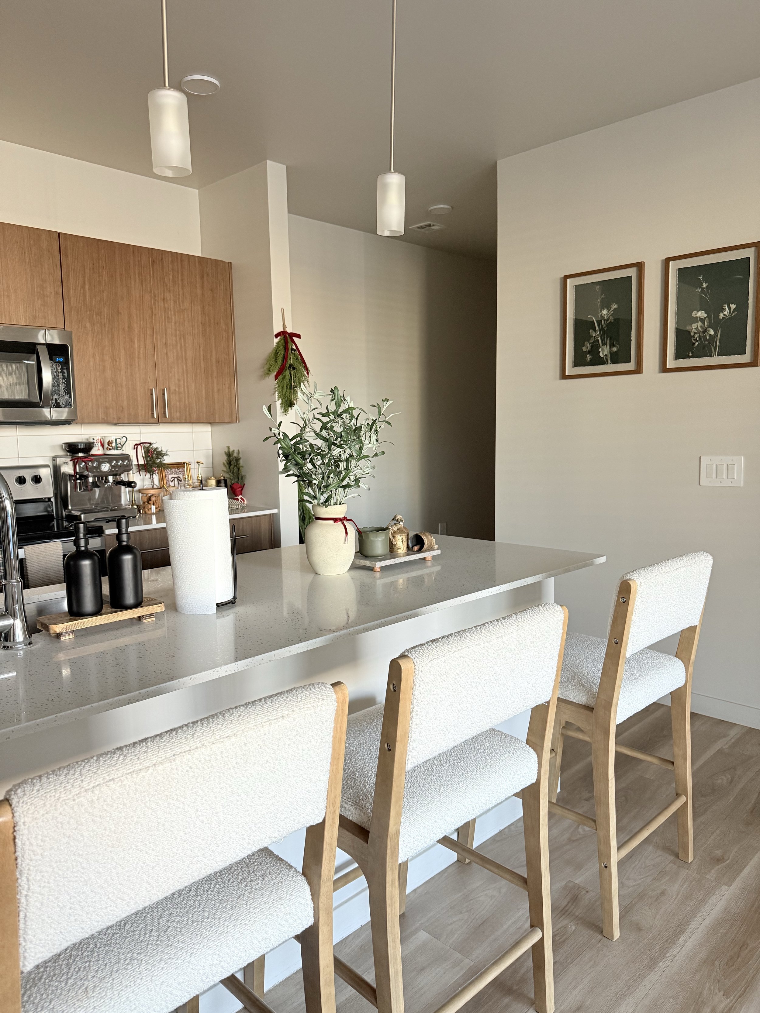 A bright, clean, and tidy apartment kitchen.