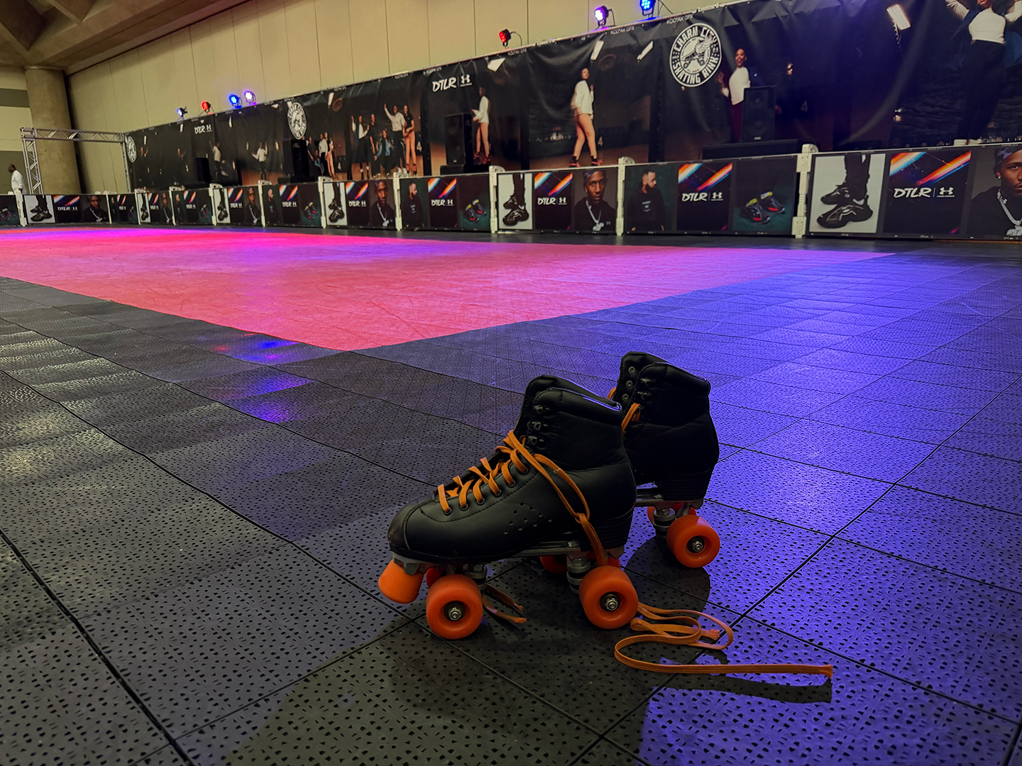 Skating rink with skates in the foreground