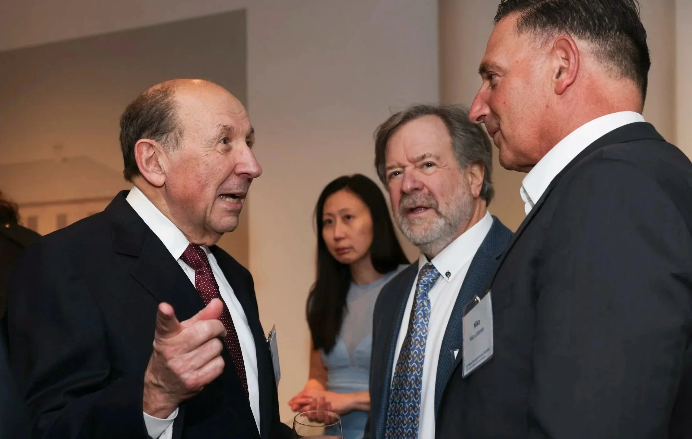 John Ranelli talking business colleague Niko Lahanas and pointing