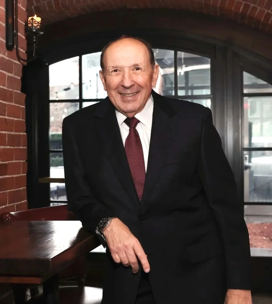 John Ranelli portrait in brick room