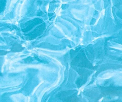 Close-up of a swimming pool's water surface with ripples and reflections.