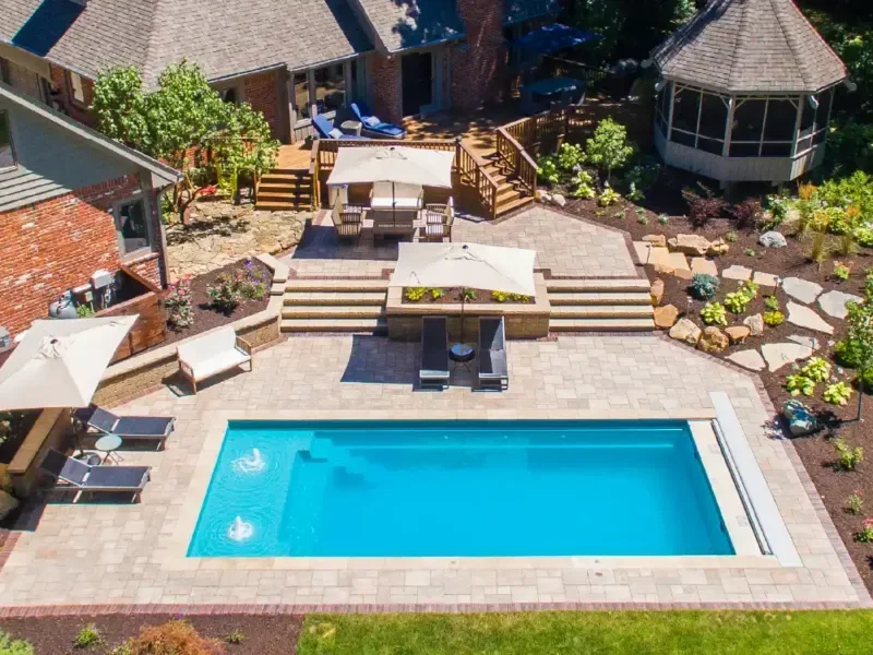 Reef Blue fiberglass pool color creating a tranquil backyard oasis
