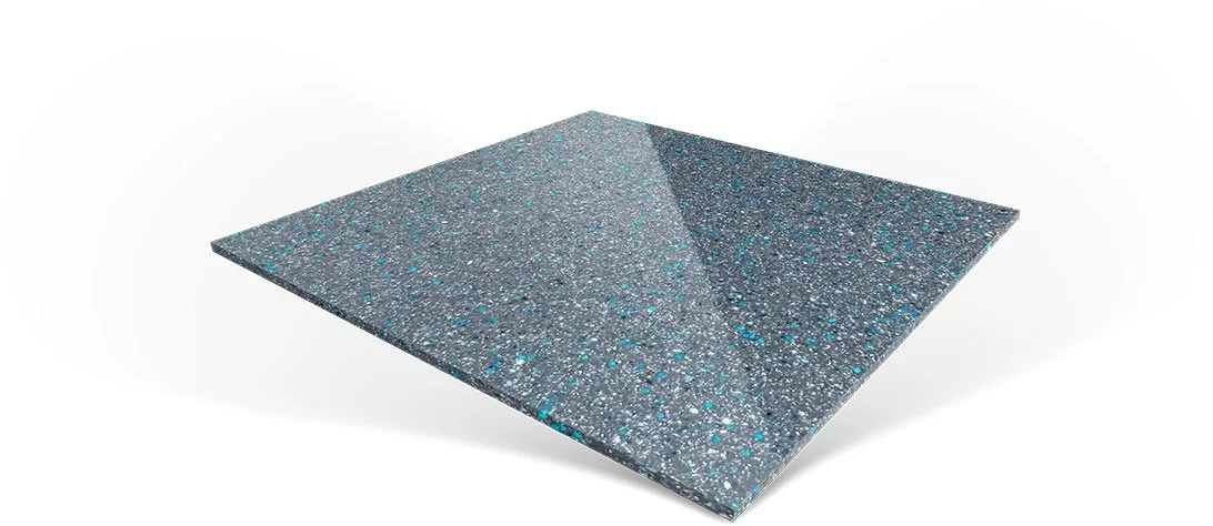 A glittery, textured, dark-colored trapezoidal object with a sloped surface.