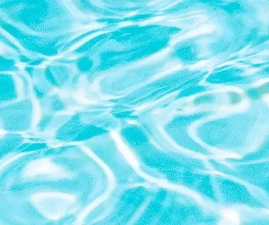 Close-up of water with light reflections creating ripples.