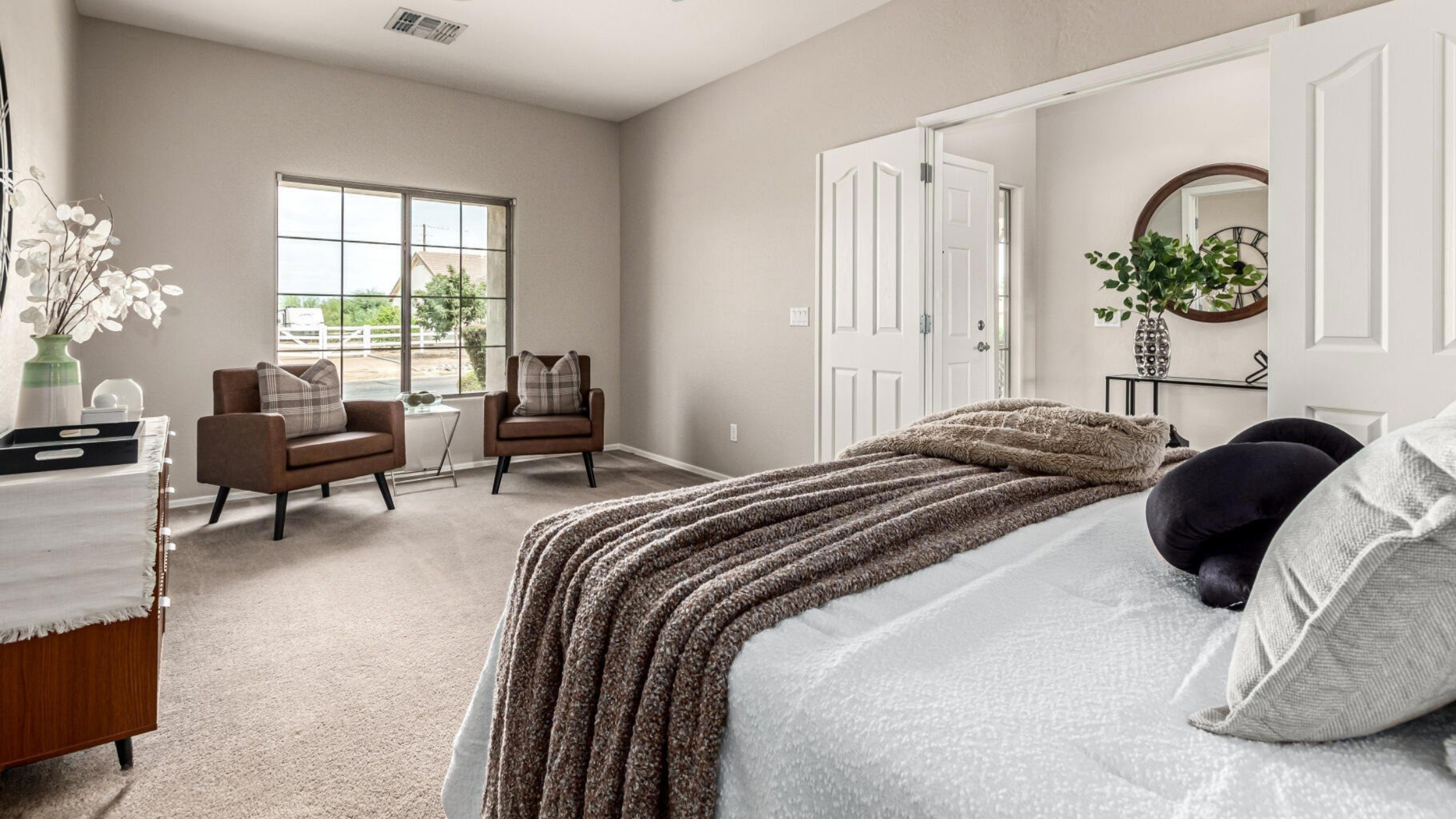 Primary bedroom home staging in Phoenix with calm, neutral design