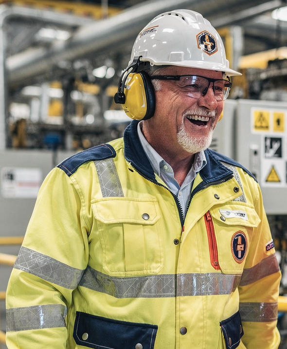 Happy manufacturing worker