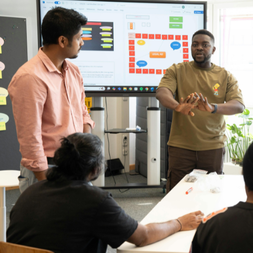 Colleagues brainstorm in boardroom