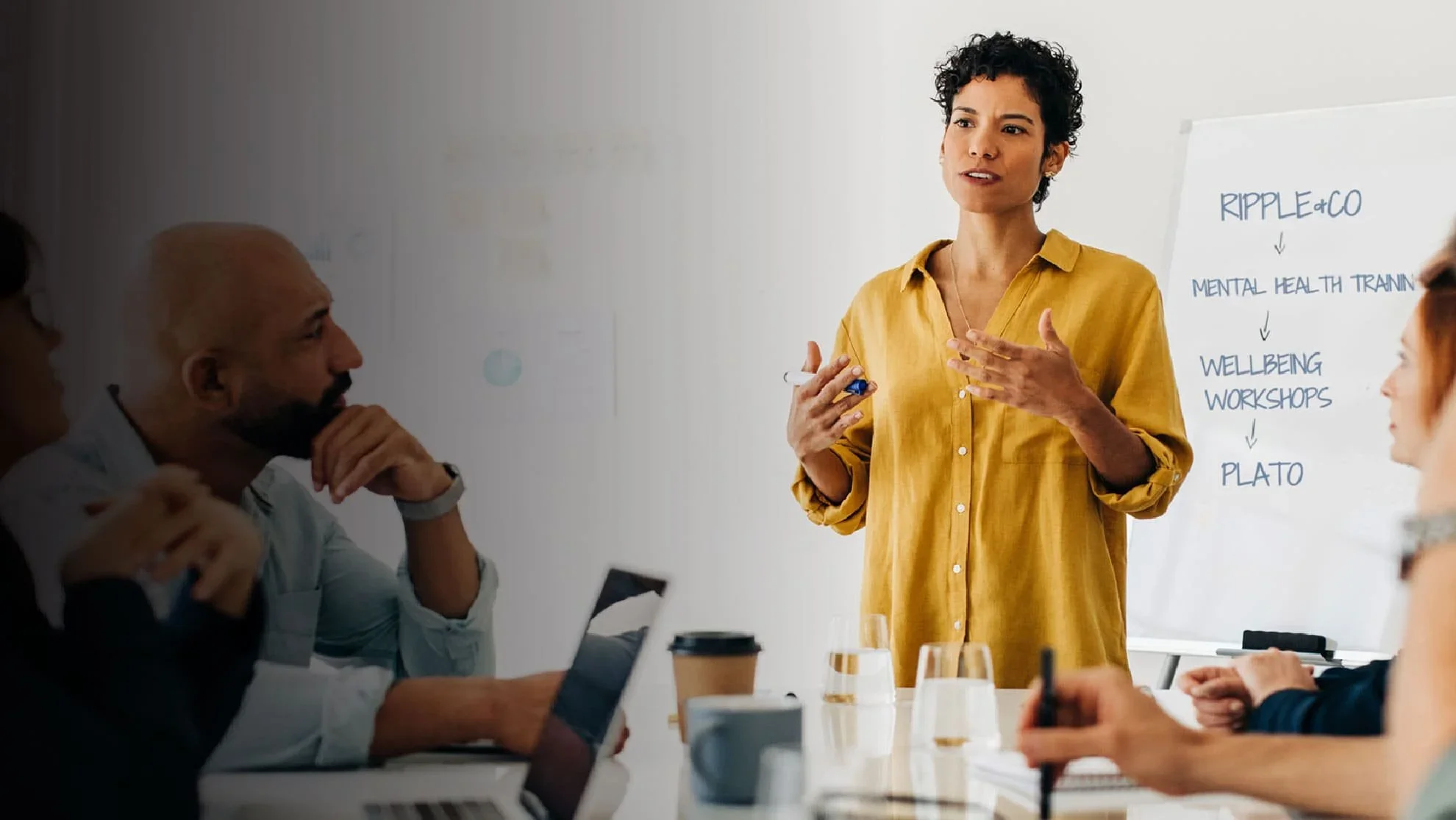 Female manager talks to colleagues