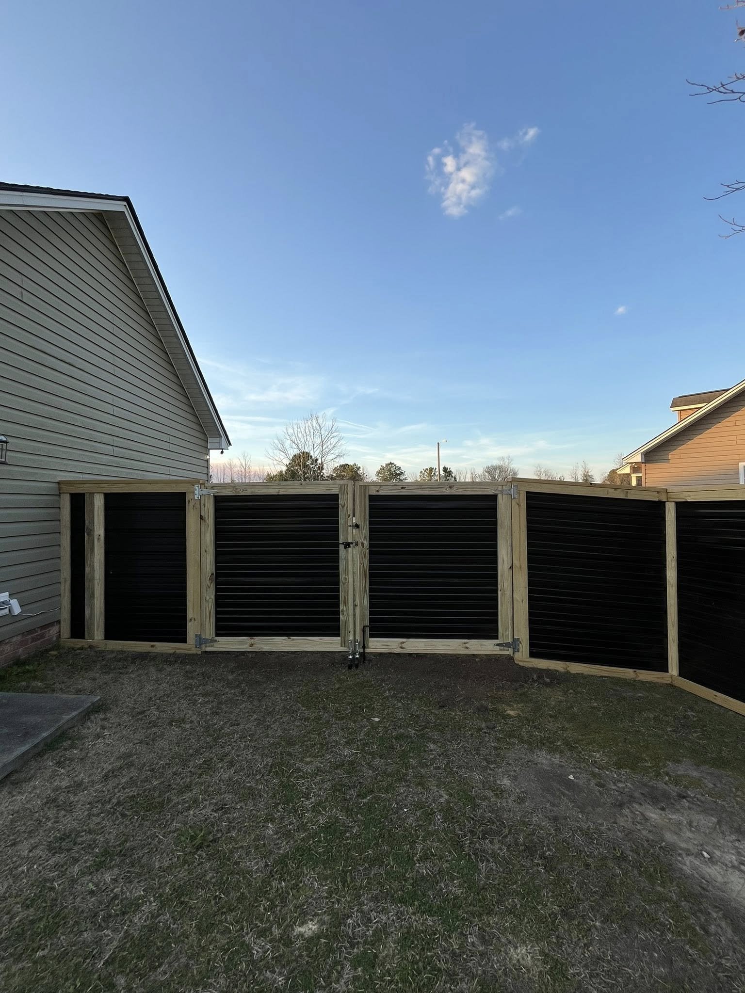 Custom Black corrugated metal privacy double gate built by Johnson Family Construction