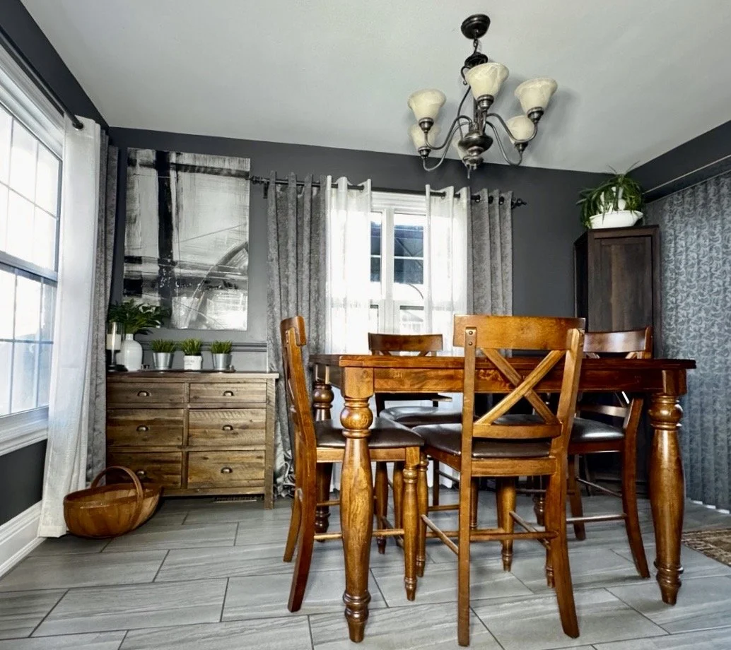 Waubaushene Ontario dining room repaint with dark grey walls white trim and wood table