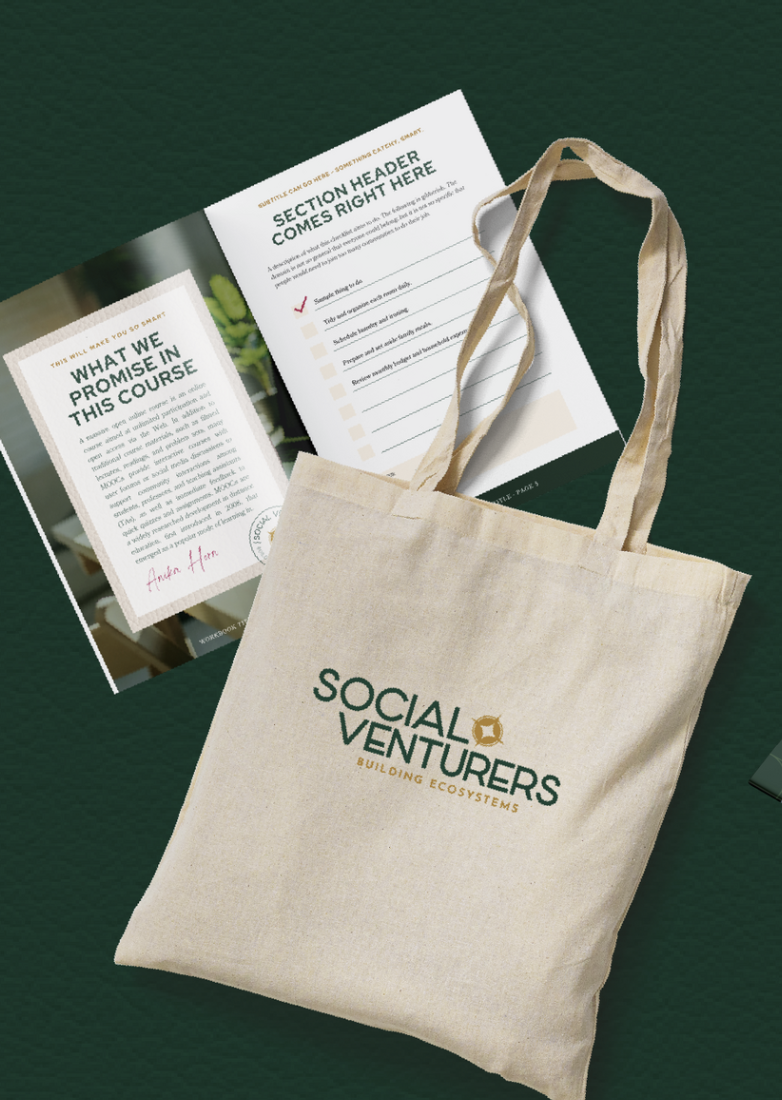 A beige tote bag with the logo 'Social Venture Building Ecosystems' placed on a dark green surface. Next to it are a brochure and a leaflet related to a course or event.