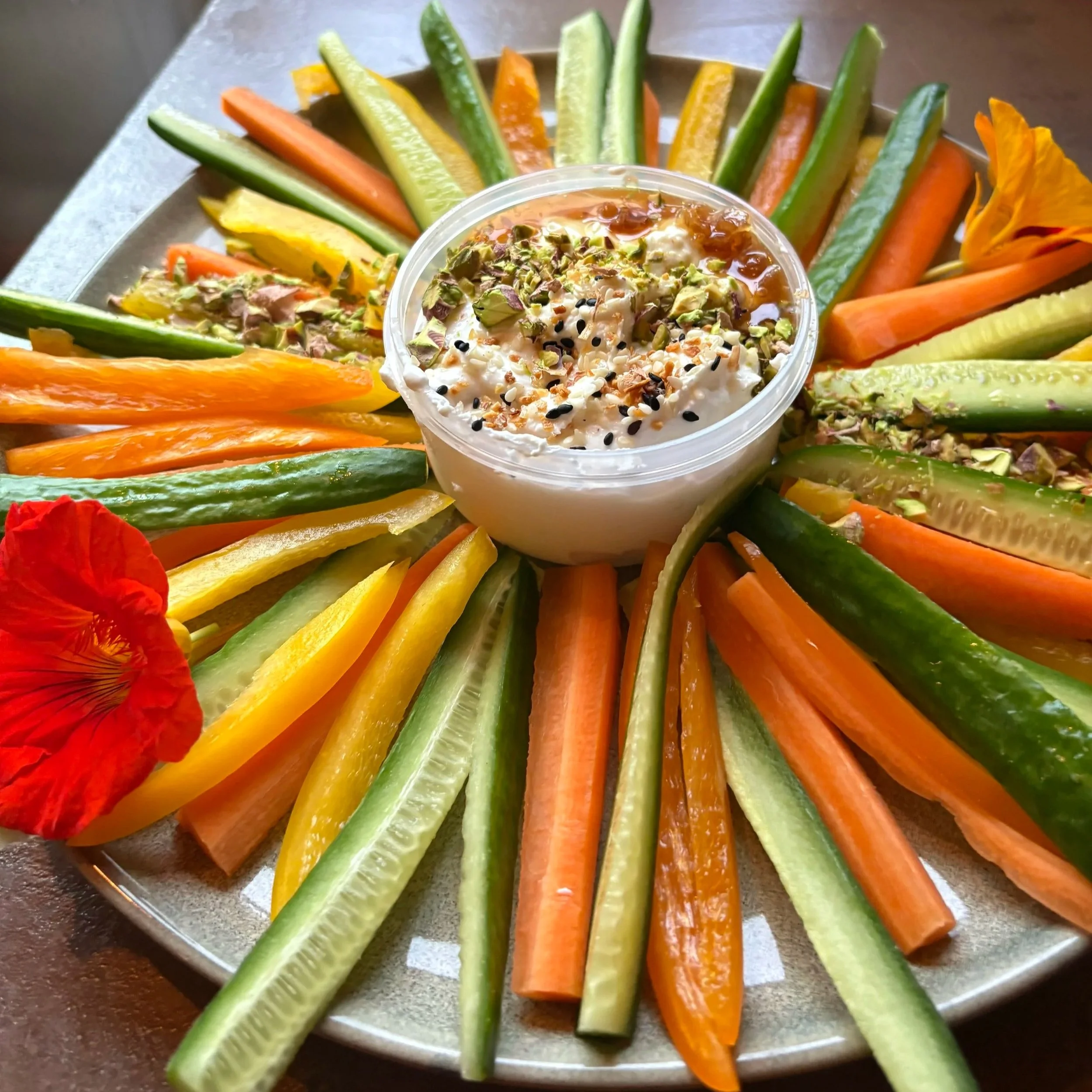chef prepared appetizer platter with whipped feta and fresh vegitables for vacation rental guests on the southern oregon coast