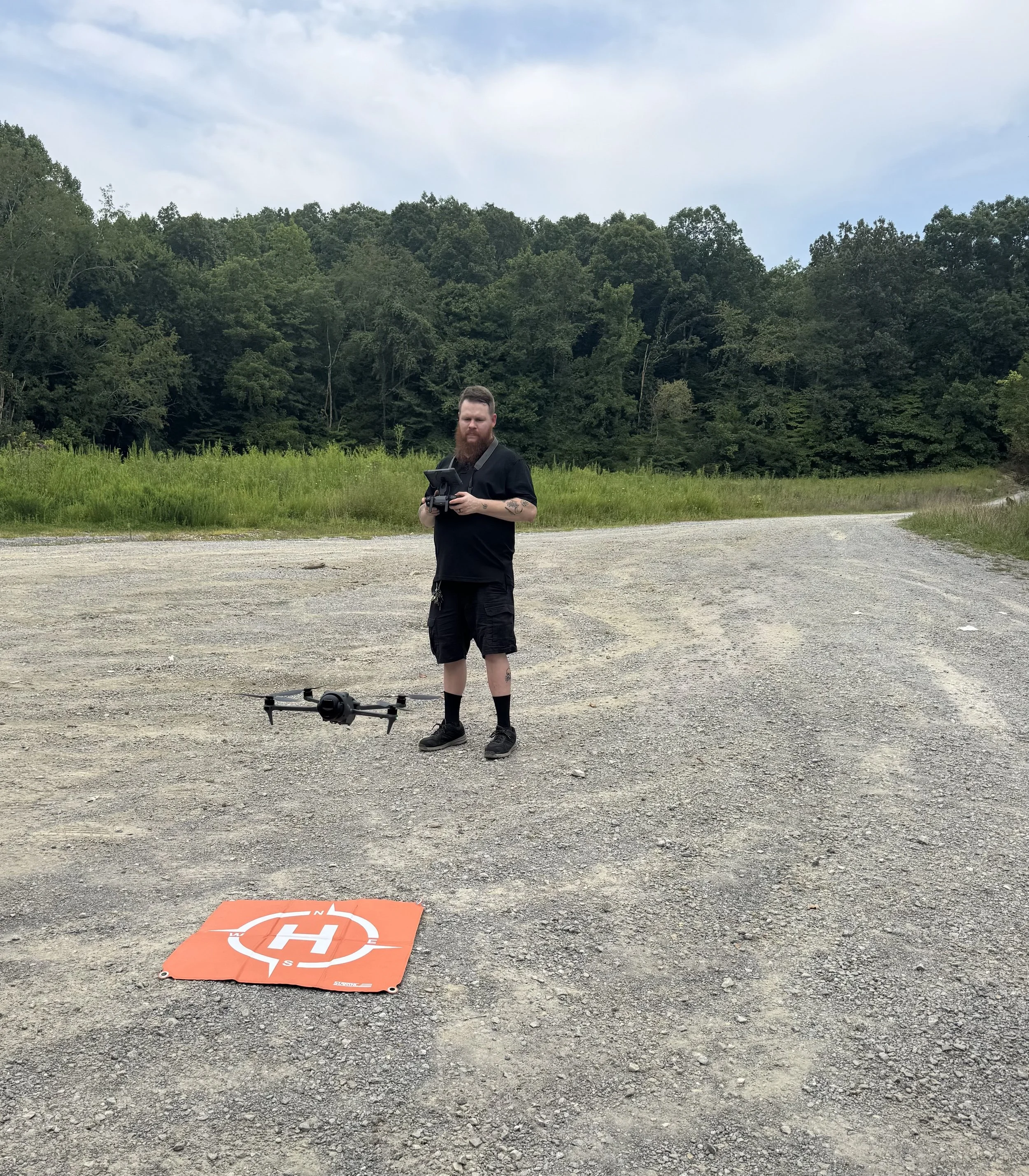 FAA-certified drone pilot Joshua Lowery operating a drone in Central Indiana