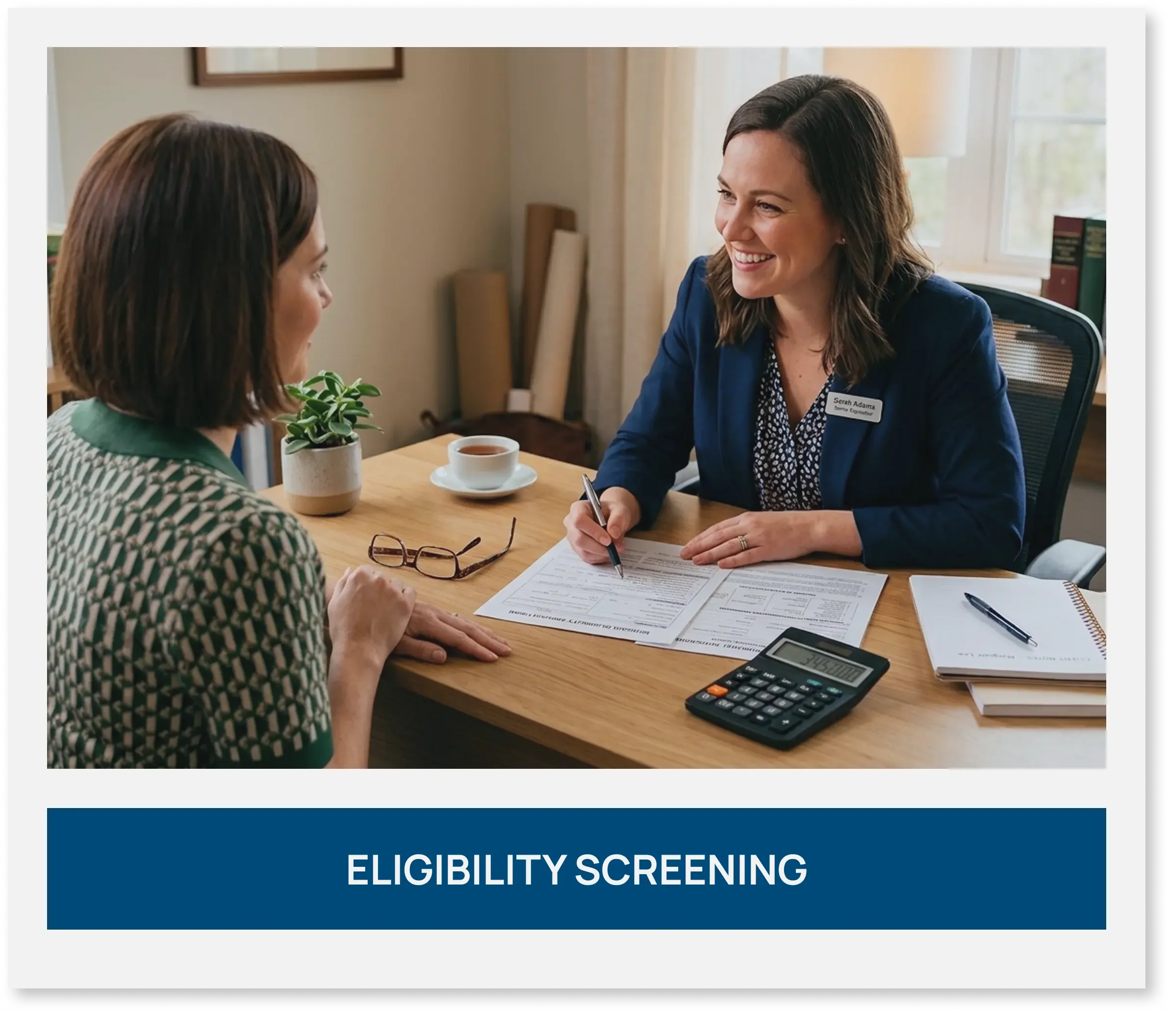 Specialist reviewing documents with a client during an eligibility screening meeting.