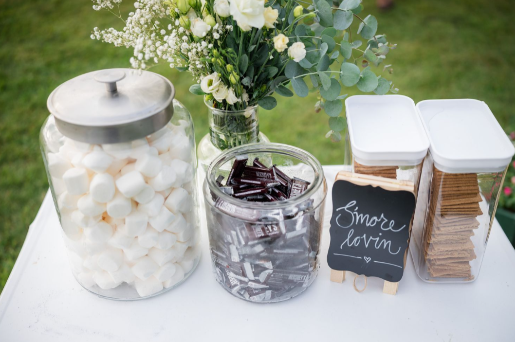 reception decor smore bar with flower arrangement