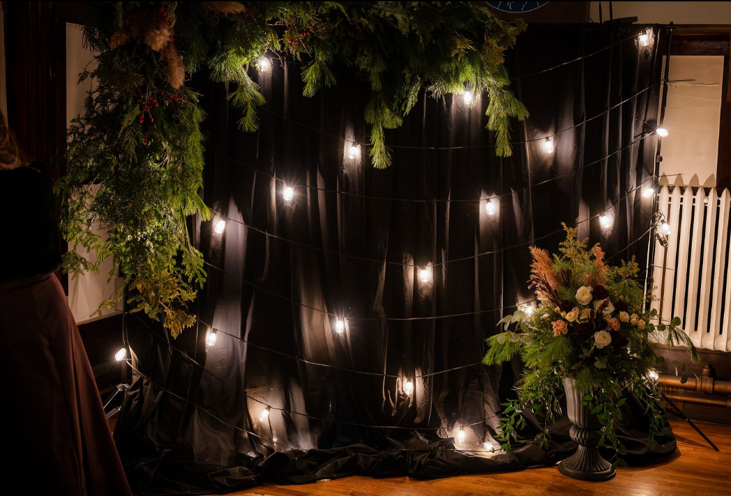 picture station with lights and winter greenery