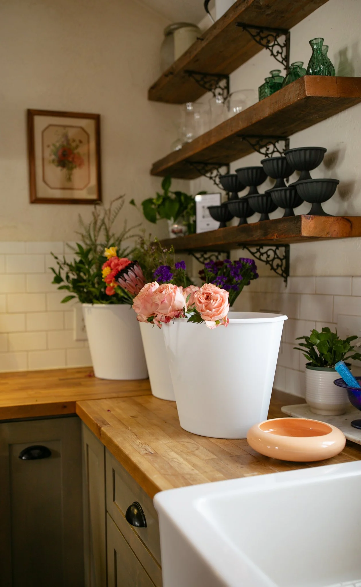 floral shop buckets of flowers shelves with vessels