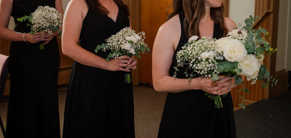 bridesmaids holding babys breath bouquets