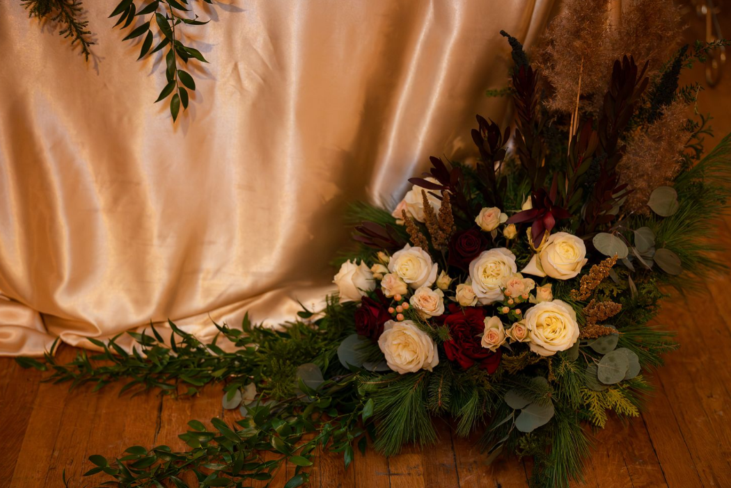 floor piece in front of table with champagne satin cloth