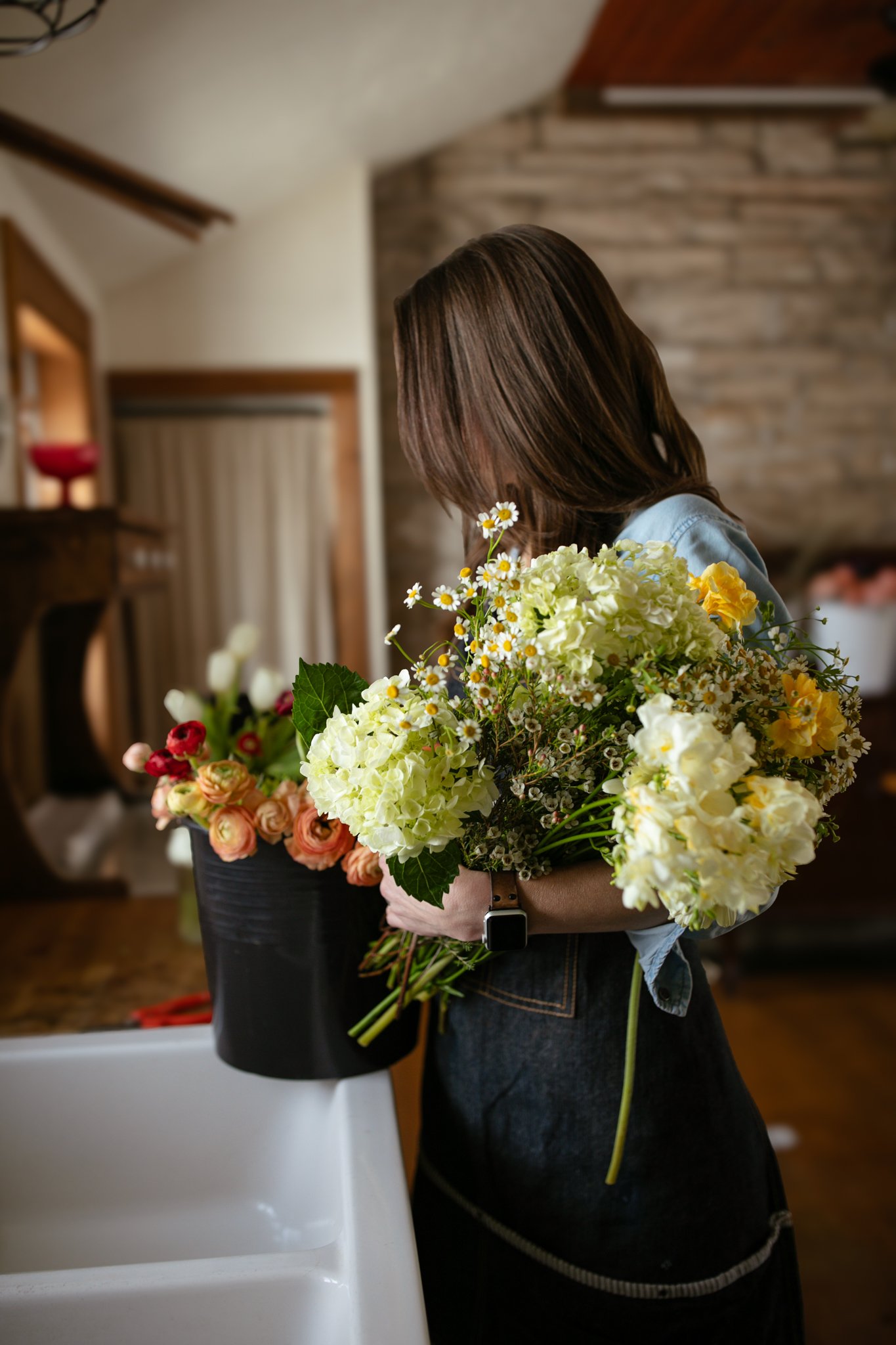 Florist holding gathered flowers