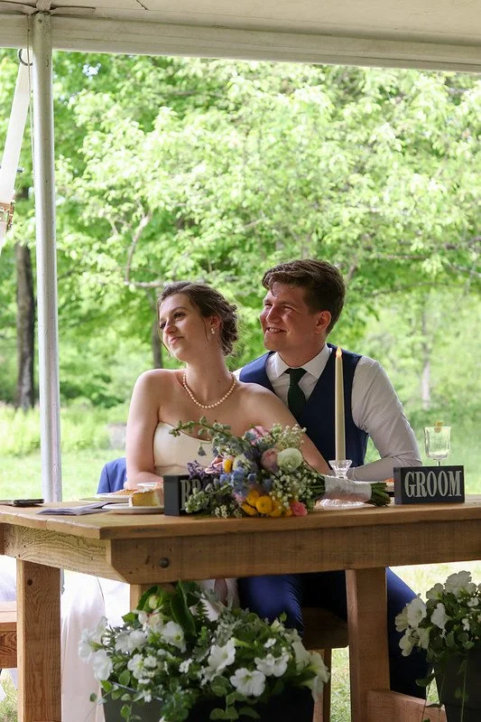 bride and groom at sweetheart table