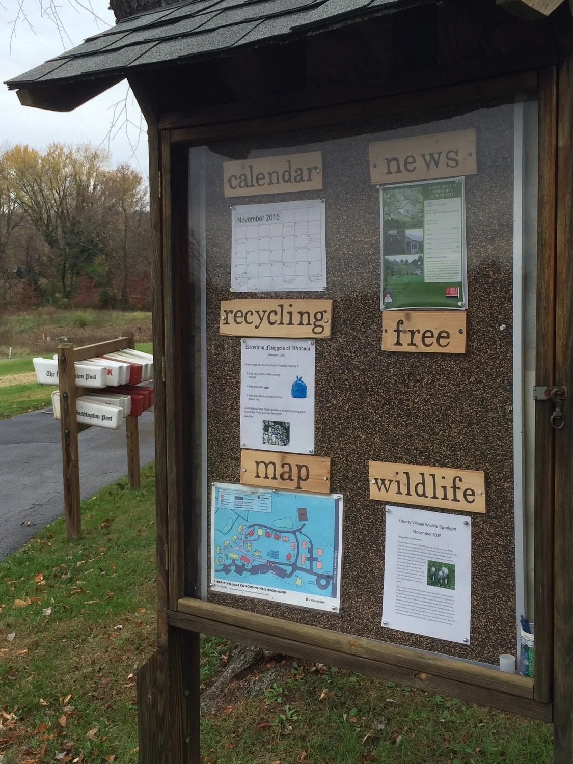 Liberty Village's community bulletin board with areas for the calendar, news, recycling, free, map, and wildlife information.