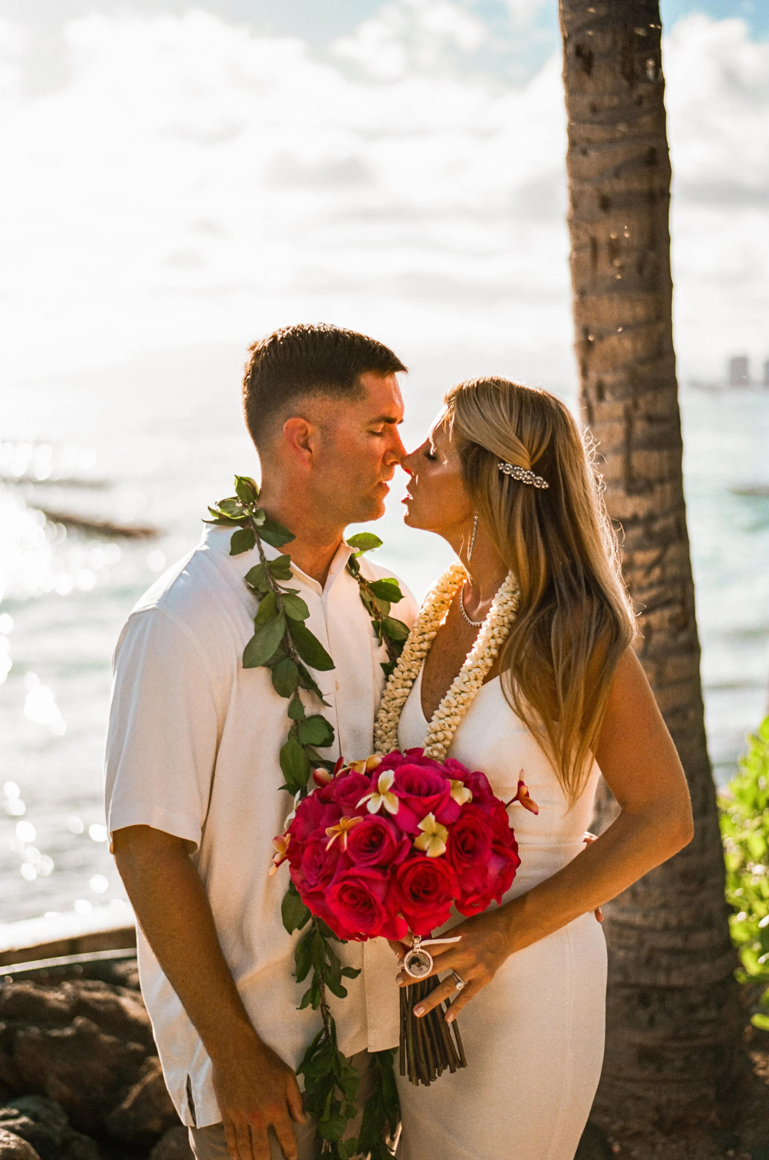 Couple intimate wedding portrait shot on 35mm film in Oahu Hawaii.