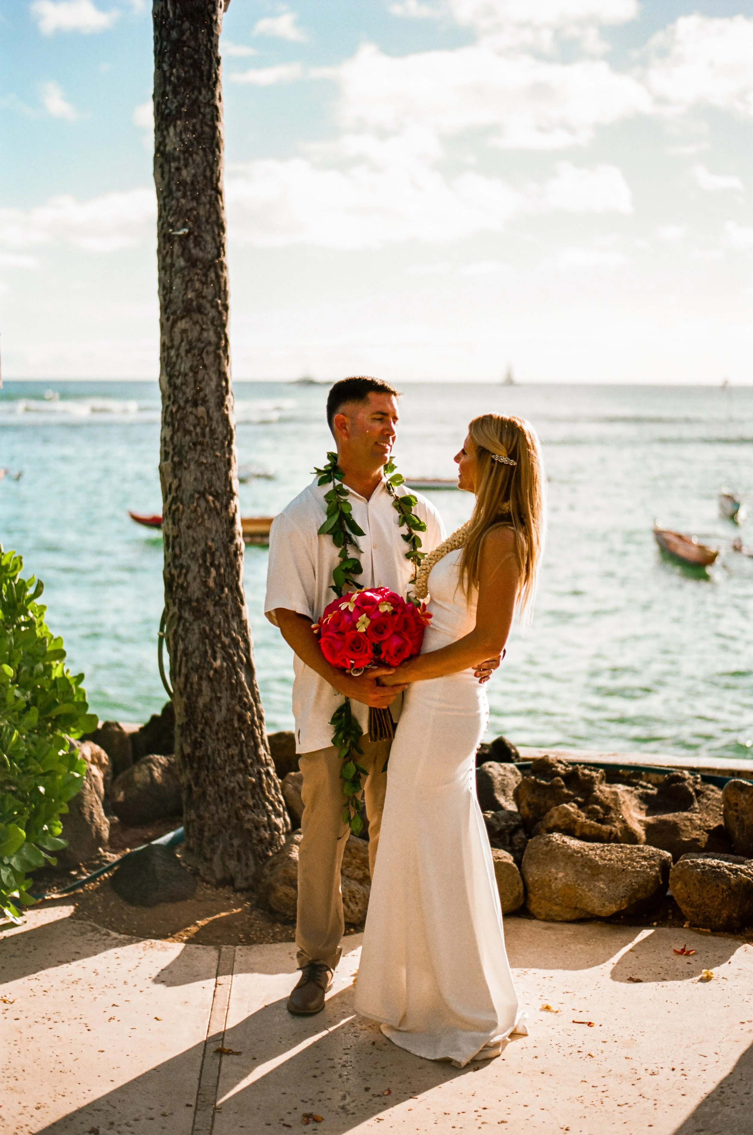 Couple intimate wedding portrait shot on 35mm film in Oahu Hawaii.