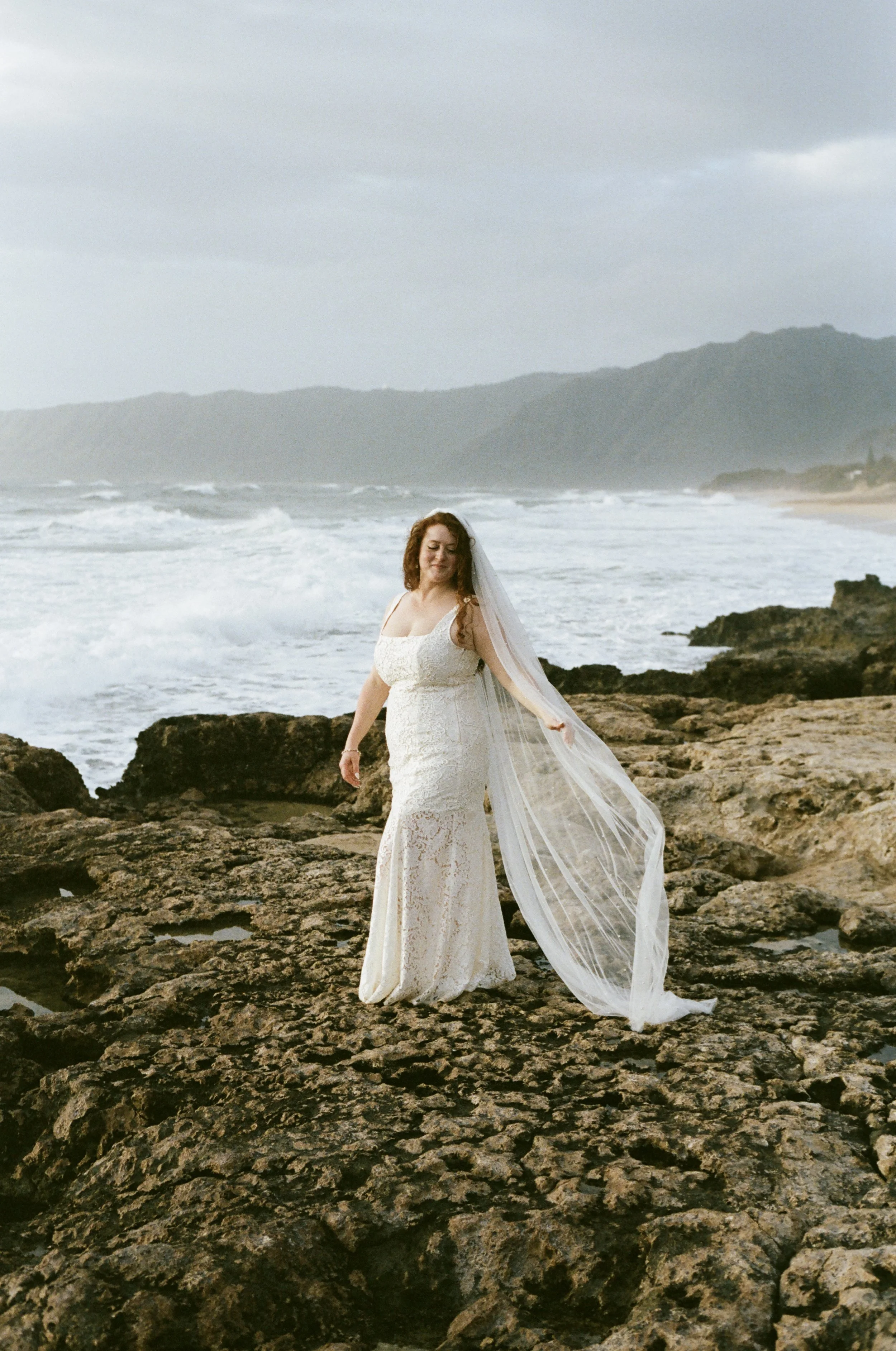 Couple intimate wedding portrait shot on 35mm film in Oahu Hawaii.
