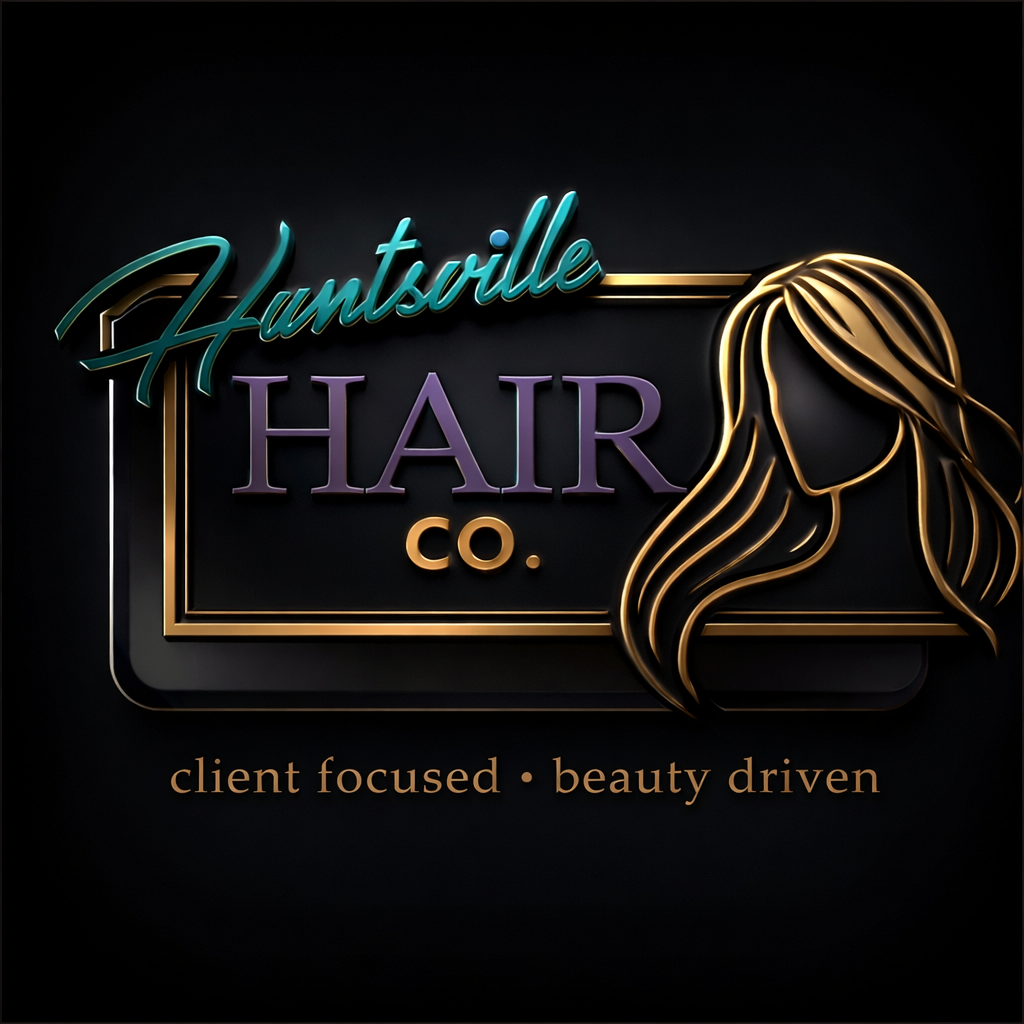 Neon sign for Hantsville Hair Co. with a drawing of a woman's hair and the tagline "client focused, beauty driven" on a dark background.