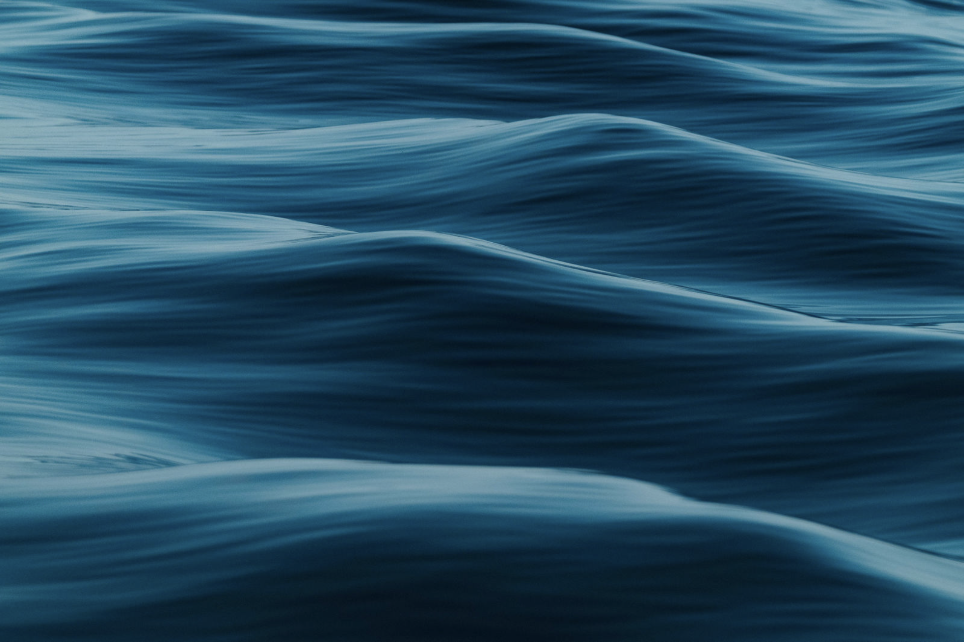 Photograph print depicting close-up of blue water surface with gentle waves and ripples.