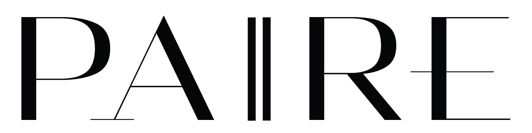 Close-up of the word "PAIRE" in large, black, stylized font on a white background