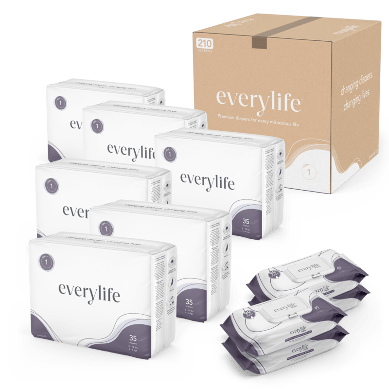 A collection of Everlyfe brand baby diapers, including multiple packs of different sizes, and a large cardboard box for bulk purchasing.