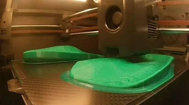 orthotic being 3d printed before covering and fitting