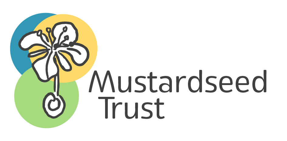 Logo of Mustardseed Trust featuring a stylized flower with yellow, blue, and green backgrounds and the words 'Mustardseed Trust' next to it.