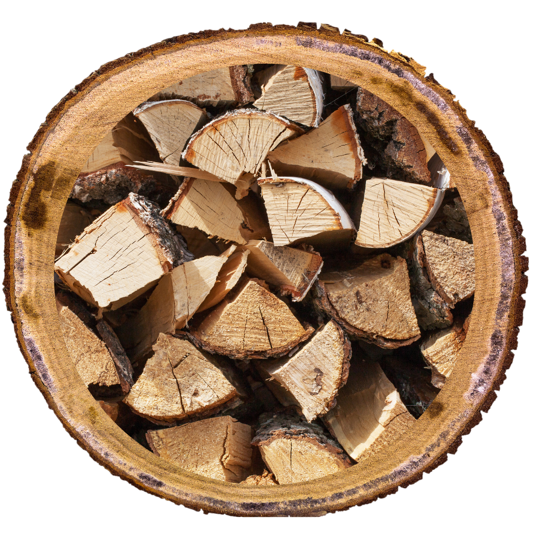 Stacked firewood inside a cut log, showing the rough bark exterior and split wood interior.