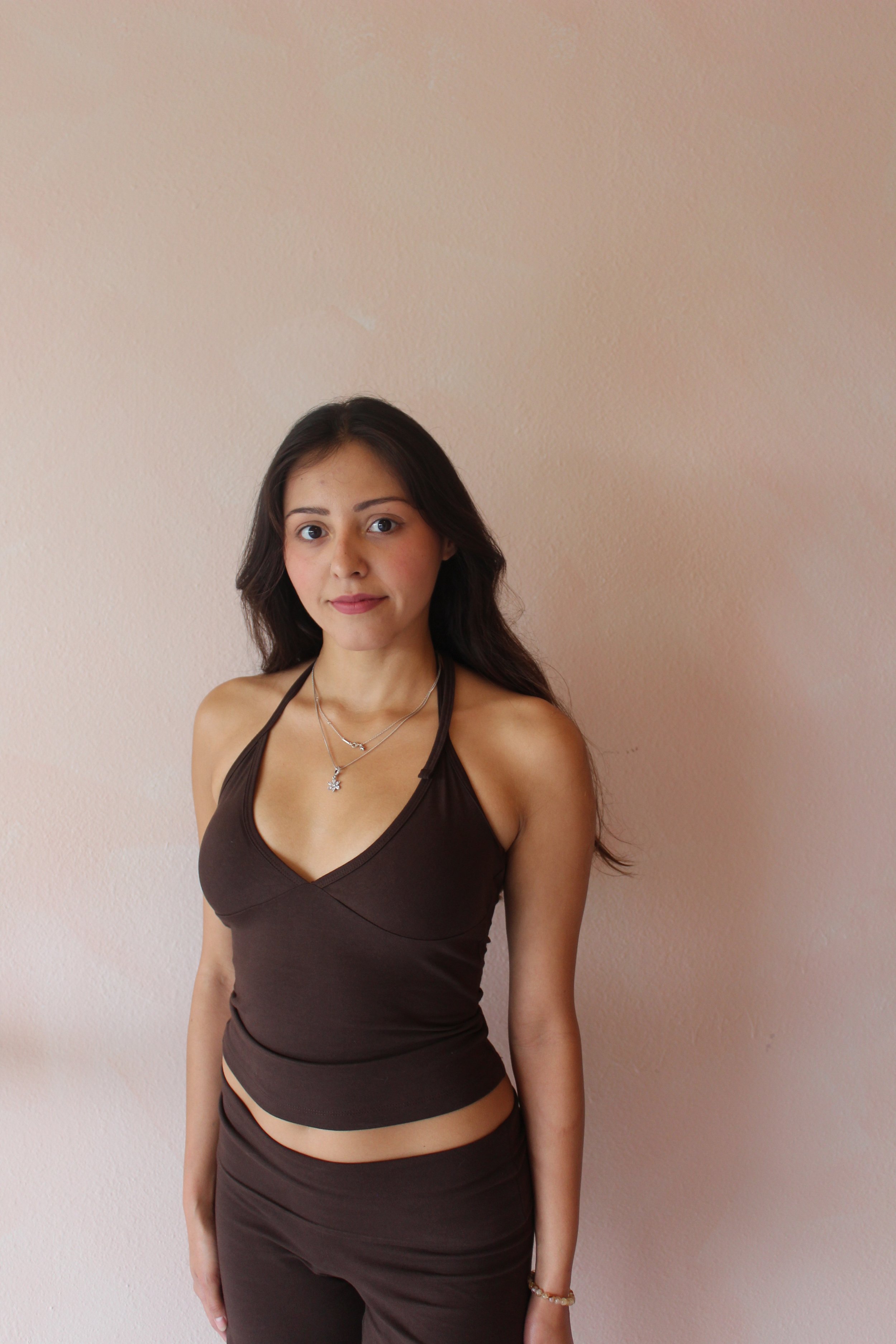 Pilates instructor Valery standing in a dark athletic outfit at Third Space Studios in Houston