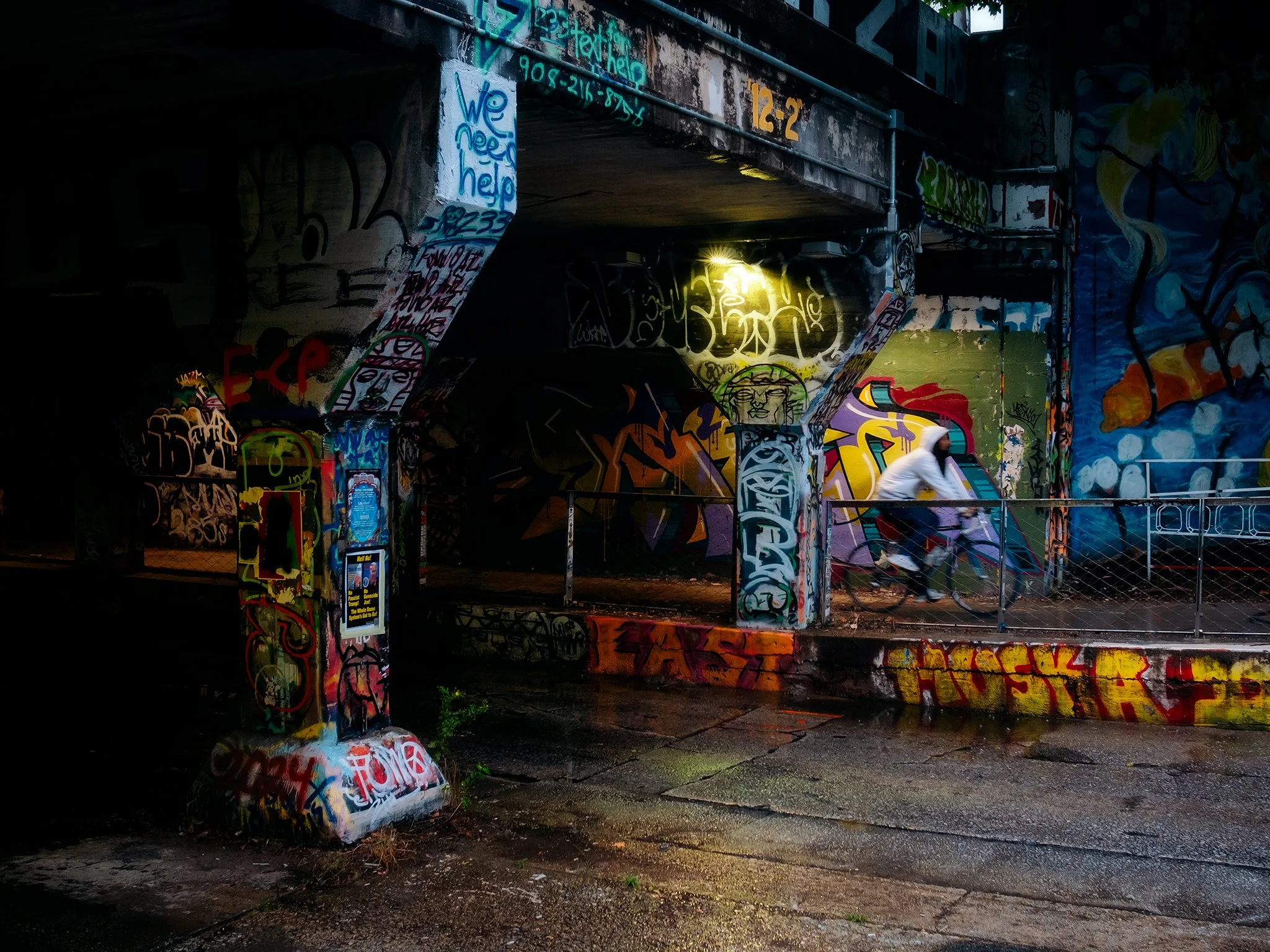 Cyclist riding through Krog Street Tunnel 