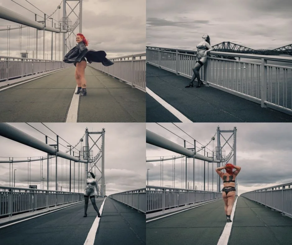 Four women with red hair posing on a bridge with a city skyline and cloudy sky in the background, wearing different outfits. Two are in black and white, and two are in color.